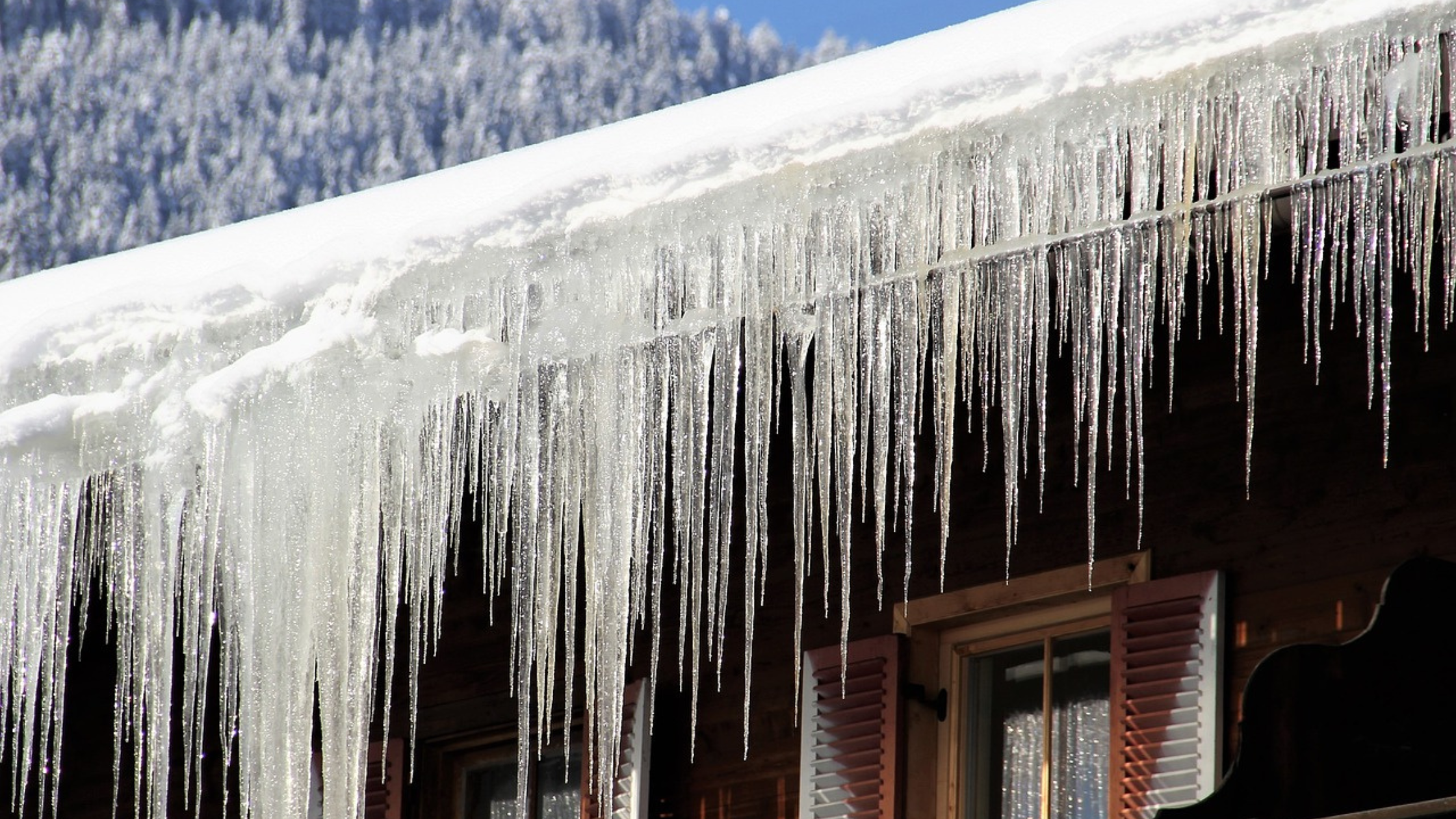 Ice Dams hanging from the roof of a house
